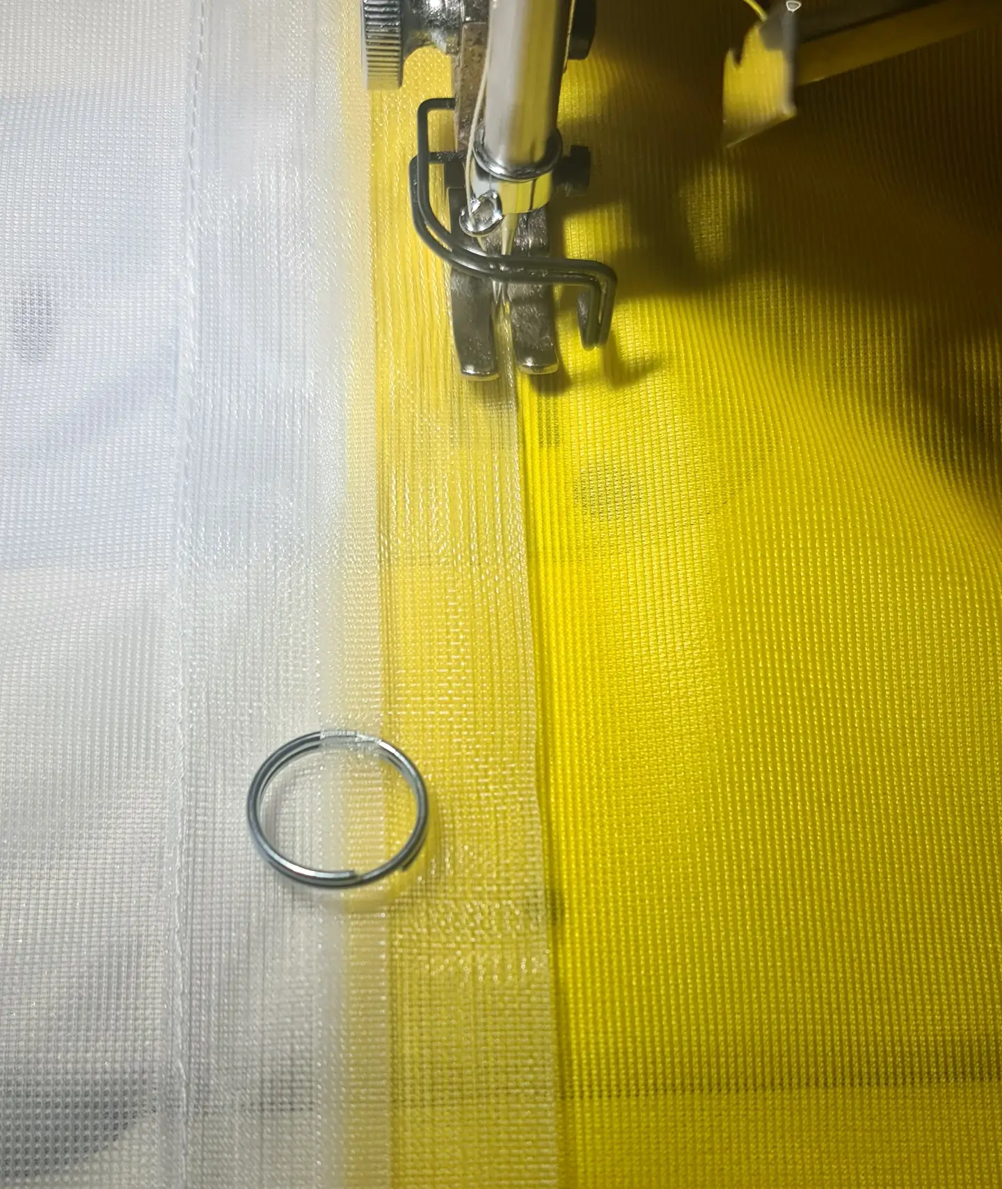 Ringbandsicherung auf die Fahne genäht